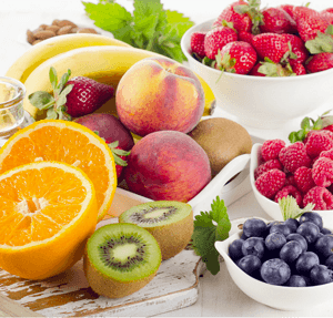 Fresh mixed fruits, honey and berries. Healthy eating. Selective focus